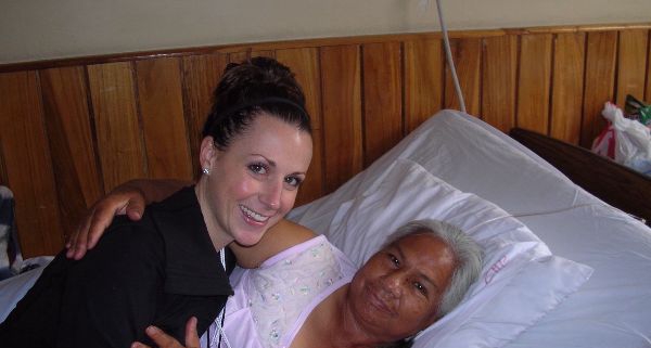 CAMTA member hugging and smiling with a patient