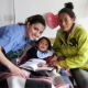 CAMTA member smiling with mother and son after surgery