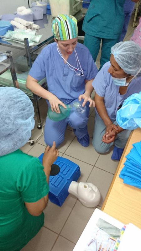 camta staff instructing other nurses on dummy